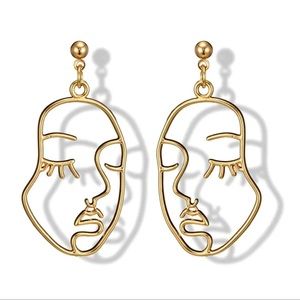 Femme face silhouette earrings
